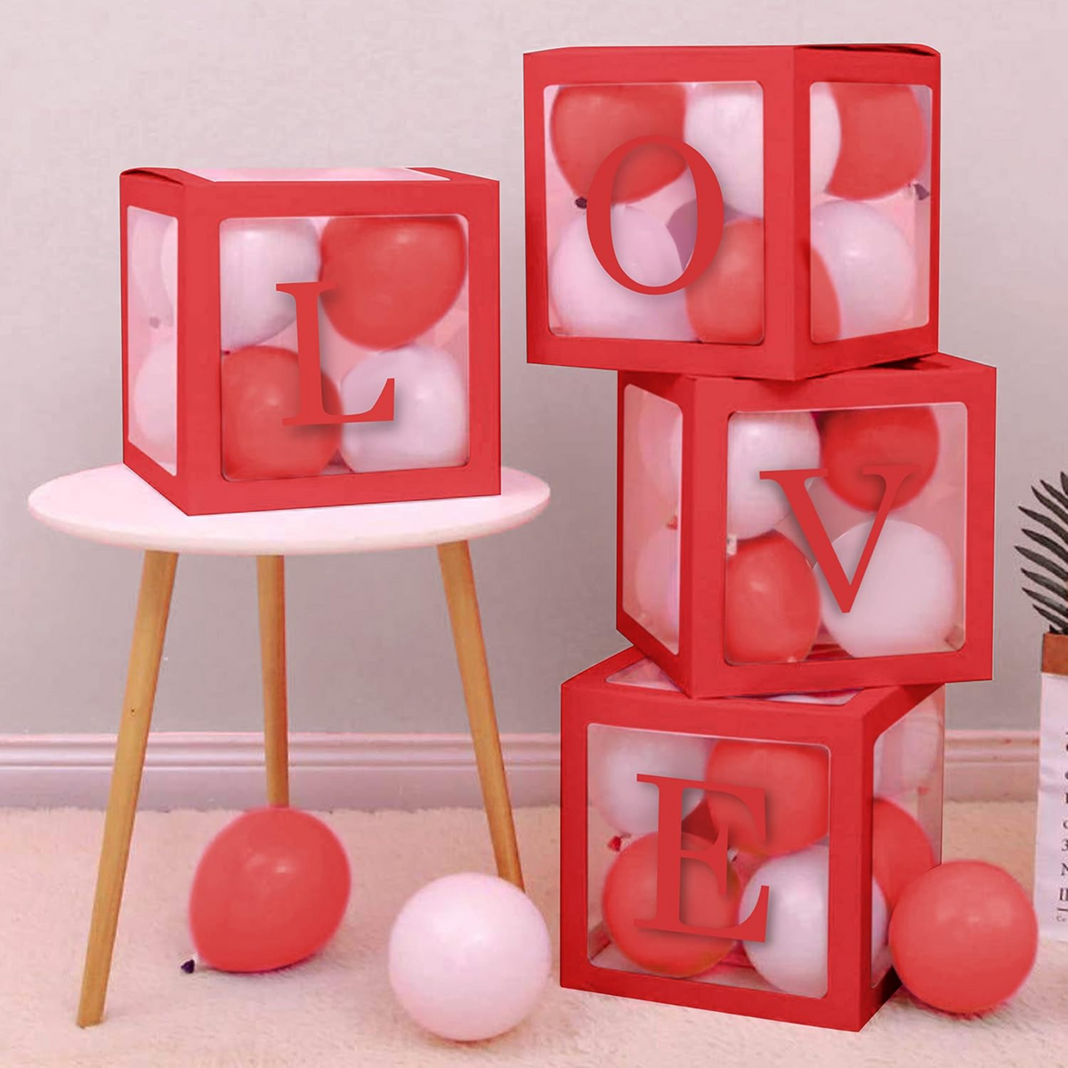 LOVE letter balloon boxes styled for a romantic celebration