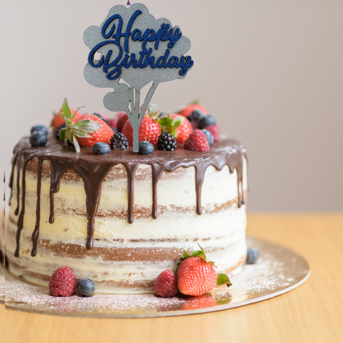 Silver glittery Happy Birthday wooden cake topper